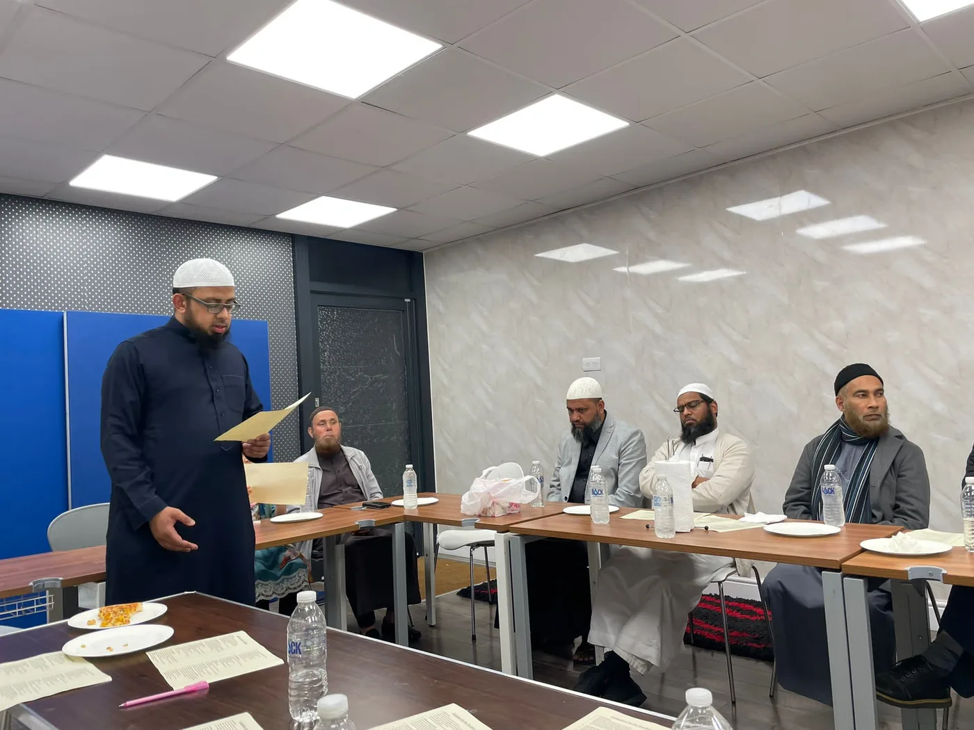 A speaker addressing Peace Home staff during a gathering in 2022.